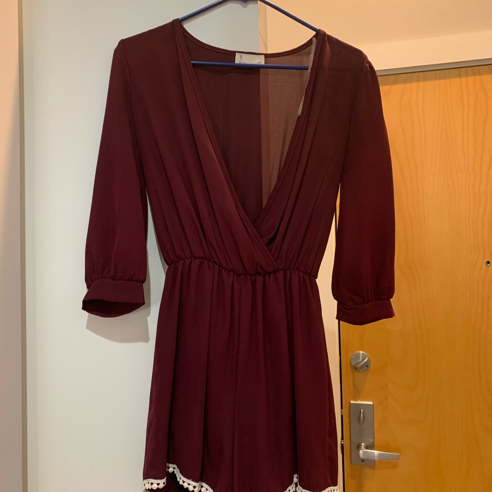 Burgundy romper with white Pom detail